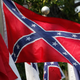 In this July 19, 2011, file photo, Confederate battle flags fly outside the museum at the Confederate Memorial Park in Mountain Creek, Ala.
